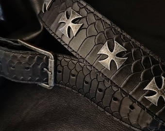 May include: Black leather belt with a snakeskin pattern and silver cross accents.