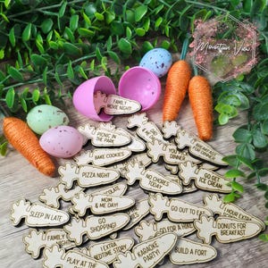 May include: Wooden carrot-shaped Easter egg hunt game pieces with various family-friendly activities written on them, such as "Family Movie Night", "Bake Cookies", "Go Shopping", and "Play at the Park".