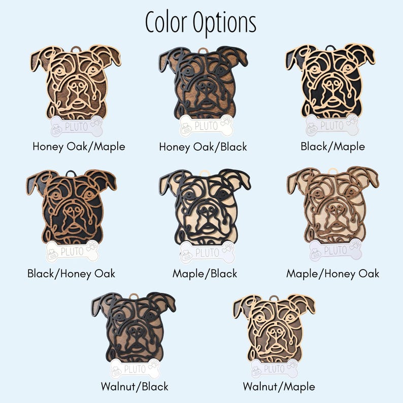 May include: Colour options for a wooden dog portrait ornament. The ornament features a stylised image of a dog's head with the name "Pluto" written below. The colour options include Honey Oak/Maple, Honey Oak/Black, Black/Maple, Black/Honey Oak, Maple/Black, Maple/Honey Oak, Walnut/Black, and Walnut/Maple.