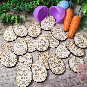 May include: Wooden Easter egg game pieces with various activities written on them, such as "Play Date", "New Book", "Skip a Chore", "Extra Dessert", "Ice Cream Sundaes", "Game Night Choice", and "Picnic Lunch".