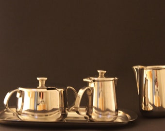 Set Alessi sugar bowl, milk jug, cream jug and serving tray