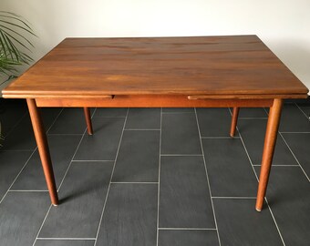 Danish manufacturer with label. 1960s dining table for four or six people. Can be extended on two sides.