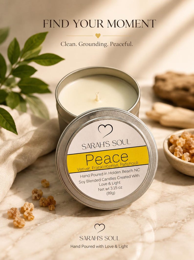 May include: A silver-colored candle tin with a white label that reads "Peace" and lists ingredients. The candle is surrounded by leaves and small pieces of amber-colored resin. The text "Find Your Moment" is at the top.