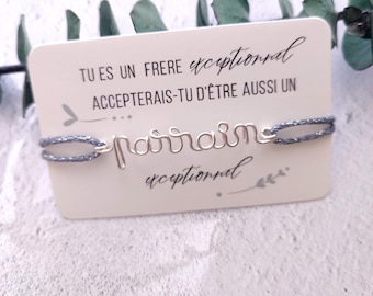 May include: A gray string bracelet with a silver wire inscription that reads "parrain" and the text "Tu es un frere exceptionnel Accepterais-tu d'etre aussi un parrain exceptionnel".