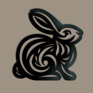 May include: A black silhouette of a rabbit with intricate floral designs cut out of its body. The rabbit is facing right and has a long, flowing tail.