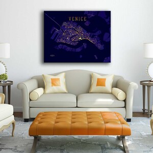 May include: A navy blue canvas print with a gold outline of the city of Venice, Italy. The print has the word "VENICE" in gold lettering at the top.