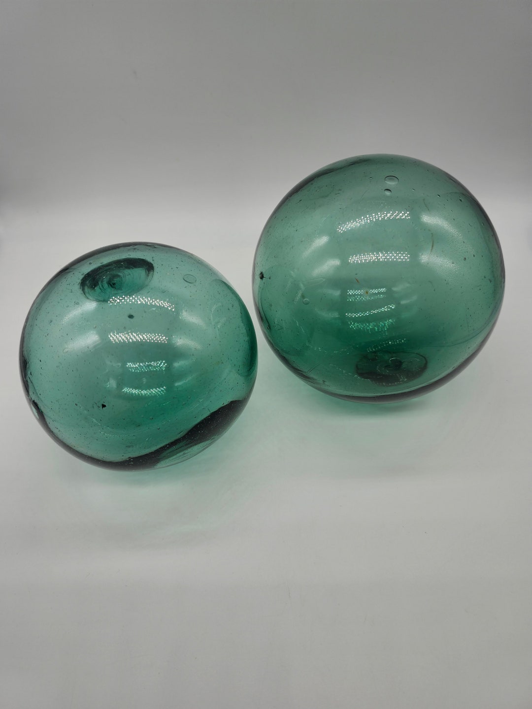 2 Large Vintage Japanese Hand Blown Glass Fishing Net Balls. 4 and 4.5