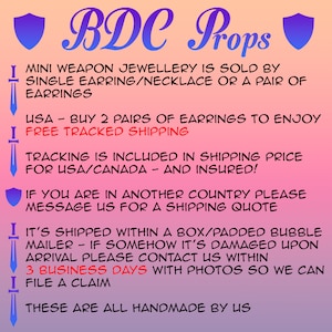 May include: A gradient pink and orange background with the text "BDC Props". The text states that mini weapon jewelry is sold as single earrings, necklaces, or pairs of earrings. The text also states that the items are handmade.