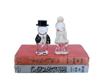 Frascos de perfume Lioret vintage de los años 30 con figura de Betty Boop y vidrio pintado en frío para decoración de tocador.