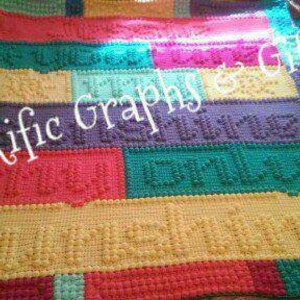 May include: A colorful crocheted blanket with a textured, bumpy surface. The blanket is made in a variety of colors, including red, orange, yellow, green, blue, and purple. The blanket is made in a patchwork style, with different colored squares sewn together. The blanket is made in a variety of stitches, including single crochet, double crochet, and bobble stitch.