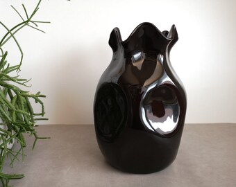 Vintage black ceramic paper bag vase, shaped like wrinkled paper, round with wavy edge.