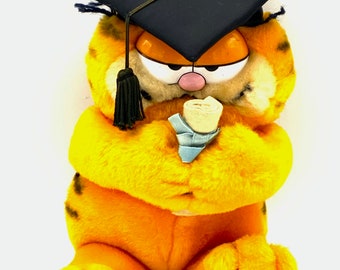 Gorgeous  collectible and vintage graduation with title Garfield, push toy, cat, orange,