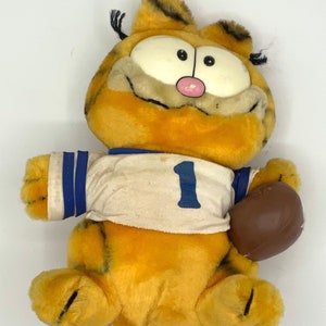 Gorgeous collectible and vintage Garfield football player, stuffed animal, toy, cat, orange, blue and white t shirt, 1.