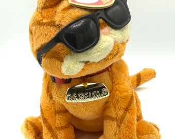 Gorgeous collectible vintage stuffed Garfield with glasses push toy, cat, orange, soft Beanie buddies.