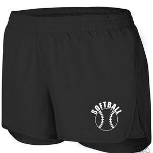 May include: Black athletic shorts with a white softball graphic and the word "SOFTBALL" printed above the ball.