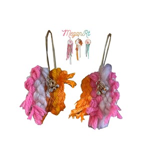 pink and orange earrings handmade yarn weaving with charms