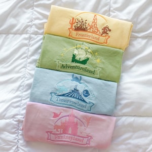 The Lands Collection | Adventure, Frontier, Fantasy, & Tomorrow | Embroidered Comfort Colors/Gildan Tee