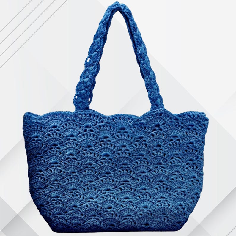 May include: A blue crochet tote bag with a scalloped top edge and braided handles. The bag features an openwork design, showcasing the intricate details of the crochet. The bag is a solid blue color and is suitable for carrying various items.