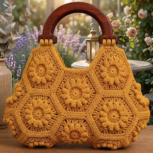 May include: A mustard yellow crochet handbag constructed from five hexagonal floral motifs. The bag features a dark brown, semi-circular wooden handle attached to the top with thick, matching yellow yarn loops integrated into the crochet design.