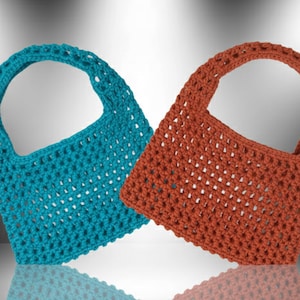 May include: Two handmade crochet tote bags. One is turquoise, the other is rust-colored. Both bags have a rectangular body with a rounded handle. The open weave design is visible throughout the bags.