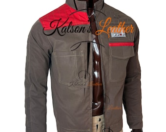 May include: A brown jacket with a red shoulder patch and a silver zipper. The jacket has two front pockets and a small red accent on the chest. The text "Kalson's Leather" is visible on the jacket. The jacket is paired with tan pants.