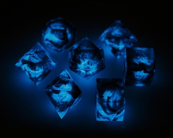 May include: A set of seven blue dice with a swirling pattern, glowing under a blacklight.
