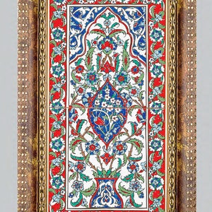May include: A framed ceramic tile with a floral design in shades of blue, red, green, and white. The tile is surrounded by a brown frame with gold accents.
