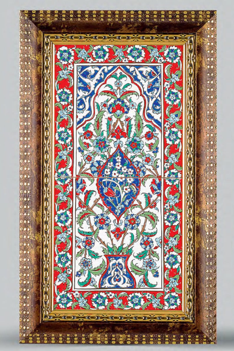 May include: A framed ceramic tile with a floral design in shades of blue, red, green, and white. The tile is surrounded by a brown frame with gold accents.