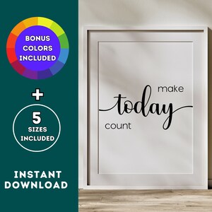 May include: A white framed print with the text "make today count" in black cursive font. The print is on a wooden surface.