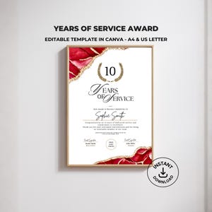 以下が含まれることがあります： 額縁に入った「Years of Service Award」テンプレート。デザインは、数字「10」と「Years of Service」の文字の上に金の月桂樹の冠が特徴です。この賞には赤と金の装飾的なボーダーがあり、名前と署名のためのスペースが含まれています。