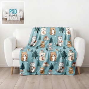 May include: A blue fleece throw blanket with a repeating pattern of bears and Christmas trees. The bears are wearing scarves and holding gifts. The background is a light blue with white snowflakes.