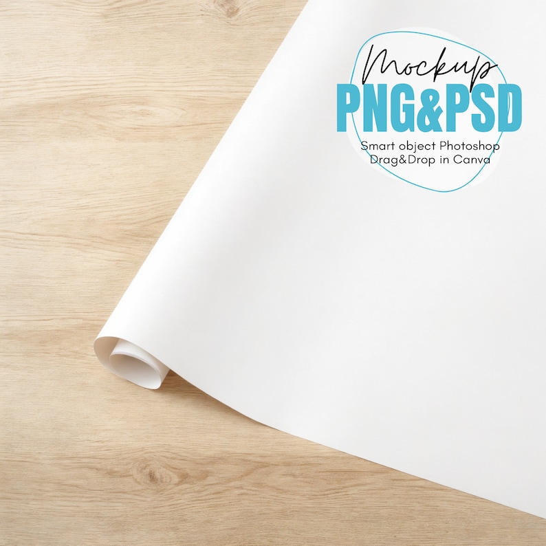 May include: A white sheet of paper rolled up on a wooden surface. The paper has a blue circle with the text "Mockup PNG&PSD Smart object Photoshop Drag&Drop in Canva" on it.