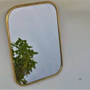 Brass wall mirror