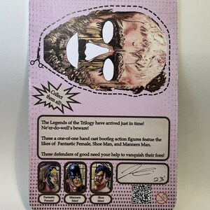 May include: A collectible card with a pink background and a vintage design. The card features a cutout face design and text that reads "Collect them all!" and "The Legends of the Trilogy". It also shows illustrations of three characters.