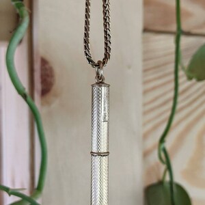 This rare 9K solid gold retractable toothpick—a unique and sophisticated blend of functionality and refinement. making a perfect gifts for luxury EDC (everyday carry) enthusiasts, or those who appreciate unconventional fine jewelry. This handcrafted piece merges discreet utility with old-world craftsmanship.  An unforgettable conversation starter for fans of unique gadgets, historical pocket accessories.