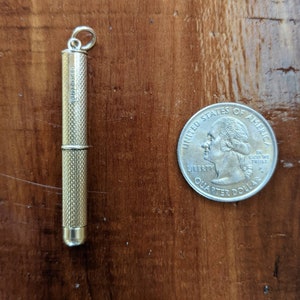 This rare 9K solid gold retractable toothpick—a unique and sophisticated blend of functionality and refinement. making a perfect gifts for luxury EDC (everyday carry) enthusiasts, or those who appreciate unconventional fine jewelry. This handcrafted piece merges discreet utility with old-world craftsmanship.  An unforgettable conversation starter for fans of unique gadgets, historical pocket accessories.