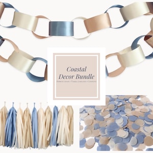 May include: A coastal decor bundle featuring a ribbon chain, tassel garland, and confetti. The ribbon chain is in shades of blue, beige, and tan. The tassel garland and confetti also feature the same color palette. The text in the image reads "Coastal Decor Bundle".