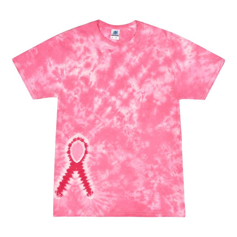 May include: Pink tie-dye t-shirt with a red ribbon design on the left side. The shirt is made of a soft, comfortable material and is perfect for showing support for breast cancer awareness.