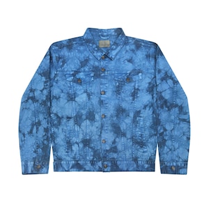 May include: A blue denim jacket with a tie-dye pattern. The jacket has a button-up front, two chest pockets, and two front pockets.