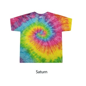 May include: A tie-dye t-shirt with a spiral pattern in shades of pink, blue, yellow, and green. The shirt is labeled "Saturn".