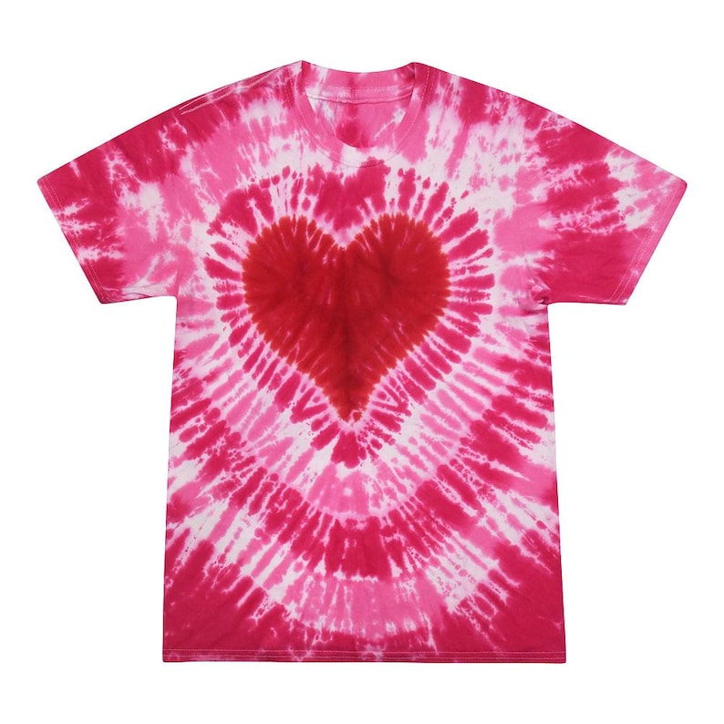 May include: A pink and white tie-dye t-shirt with a red heart design in the center.