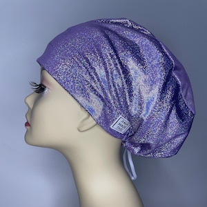 May include: Purple iridescent scrub hat with a white label that says "Ana Made This".