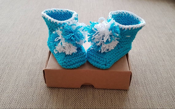 white knitted baby booties