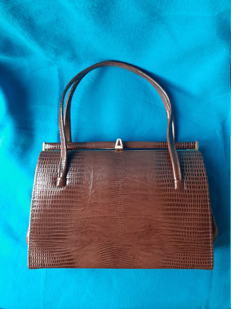 Suede lined. Vintage brown mock croc Kelly style handbag