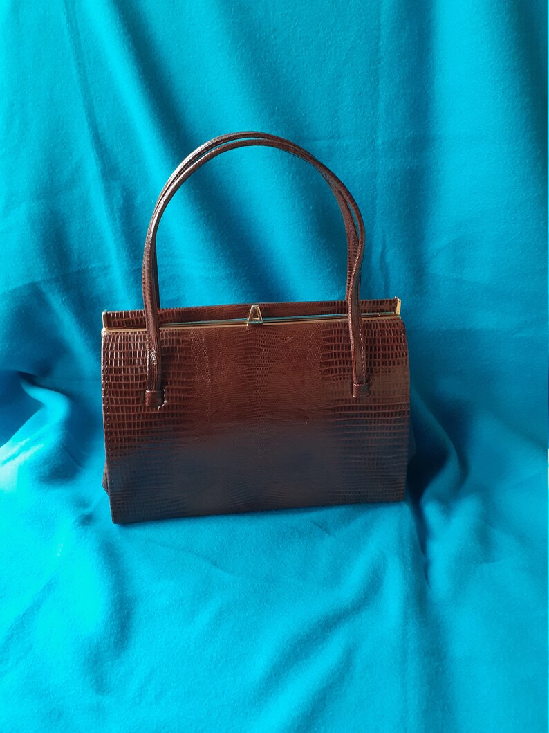 Suede lined. Vintage brown mock croc Kelly style handbag