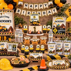 May include: A construction-themed birthday party display featuring a cake with a number one topper, yellow and black caution tape banners, signs reading Happy Birthday and Dig In, cupcakes, water bottles, snack bags, and yellow hard hats.