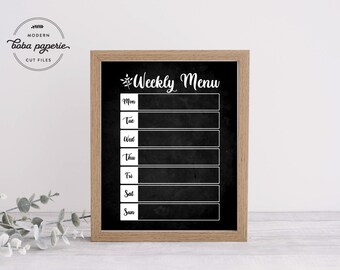 May include: A black chalkboard with a white frame and the text "Weekly Menu" written in white cursive. The chalkboard is divided into seven sections, one for each day of the week, with the days of the week labeled in white text.