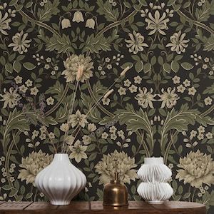 May include: Dark floral wallpaper featuring large, stylized flowers in shades of beige and green against a black background. The design includes intricate leaf patterns and smaller floral accents. A wooden shelf displays white vases and a brass mister.