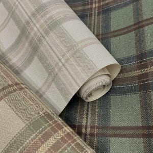 May include: Close-up of three rolls of wallpaper with plaid patterns. The rolls display a variety of colors, including beige, brown, and green. The patterns include classic plaid and herringbone designs, offering a textured and layered visual appeal.