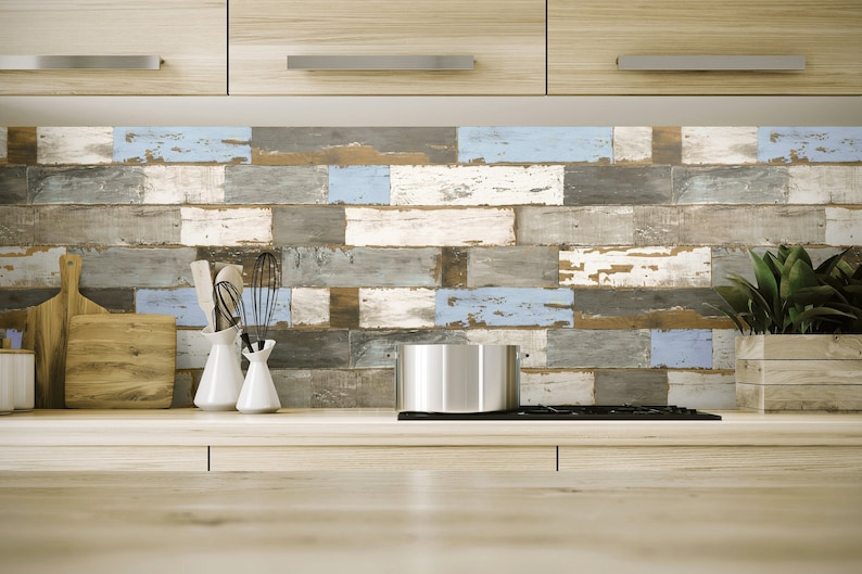 May include: A kitchen backsplash with a rustic wood plank design in shades of blue, gray, and brown. The backsplash is made of ceramic tiles and has a distressed look.